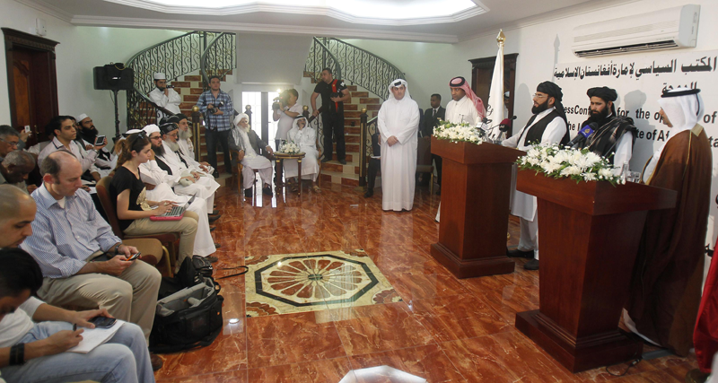 Muhammad Naeem (2nd R), a spokesman for the Office of the Taliban of Afghanistan, stands next to a translator speaking during the opening of the Taliban Afghanistan Political Office in Doha June 18, 2013. The Afghan Taliban opened the office in Qatar on Tuesday to help restart talks on ending the 12-year-old war, saying it wanted a political solution that would bring about a just government and end foreign occupation. Taliban representative Naeem told a news conference at the office in the capital Doha that the Islamist insurgency wanted good relations with Afghanistan's neighbouring countries. (REUTERS)