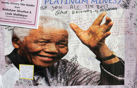 A poster of former South African President Nelson Mandela is filled with get well messages outside the Medi-Clinic Heart Hospital, where he is being treated at, in Pretoria July 3, 2013. Ailing anti-apartheid leader Mandela remained in hospital on Monday in a "critical but stable" condition, the government said. Mandela has been in the Pretoria hospital for more than three weeks receiving treatment for a recurring lung infection, his fourth hospitalisation in six months. (REUTERS)