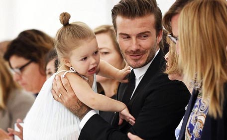 Harper Beckham is mum Victoria's mini-me in jeans and Louis