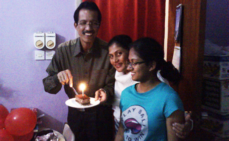 Annalie Gracias celebrates with her parents. (SUPPLIED)