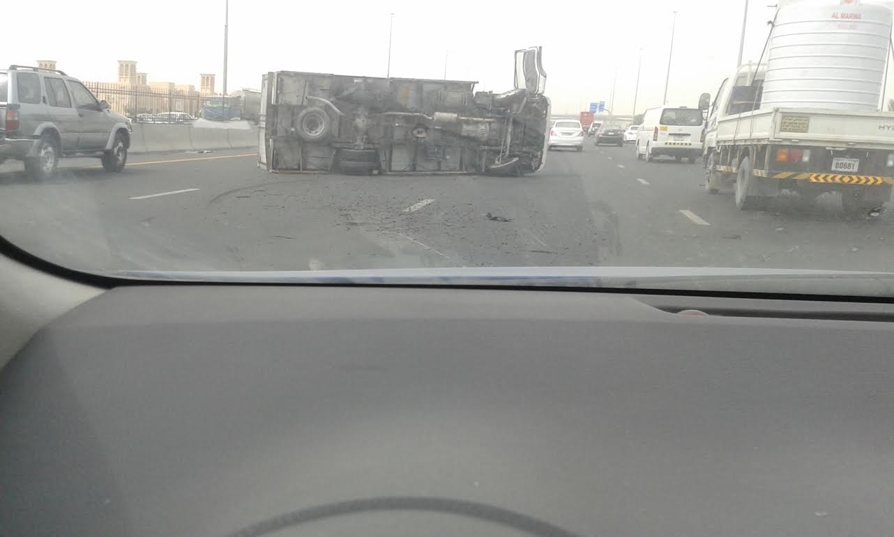 Truck overturns at Ajman-Sharjah border - News - Emirates - Emirates24|7