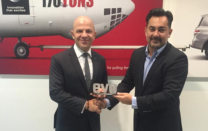 Samir Cherfan, Managing Director, Nissan Middle East receiving the award from Evo Middle East team. (Supplied)