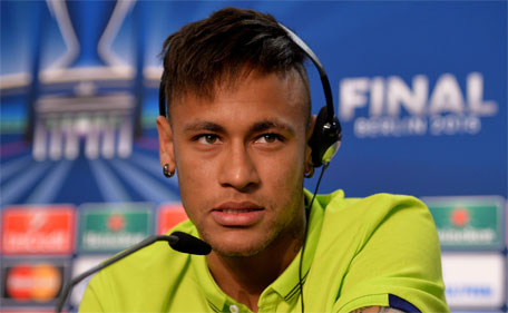 In this handout image provided by UEFA, Brazilian forward Neymar da Silva Santos Junior of FC Barcelona attends a press conference on the eve of the UEFA Champions League Final match against Juventus at Olympiastadion on June 5, 2015 in Berlin, Germany.  (AFP)