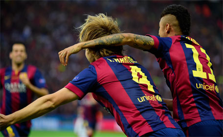 Barcelona's midfielder Ivan Rakitic (left) and forward Neymar da Silva Santos Junior celebrate the first goal during the UEFA Champions League Final football match between Juventus and FC Barcelona at the Olympic Stadium in Berlin on June 6, 2015. (AFP)