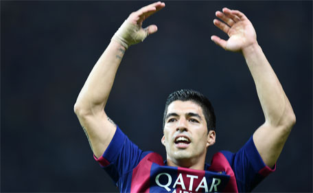 Barcelona's Uruguayan forward Luis Suarez celebrates after scoring the second goal during the UEFA Champions League Final football match between Juventus and FC Barcelona at the Olympic Stadium in Berlin on June 6, 2015. (AFP)