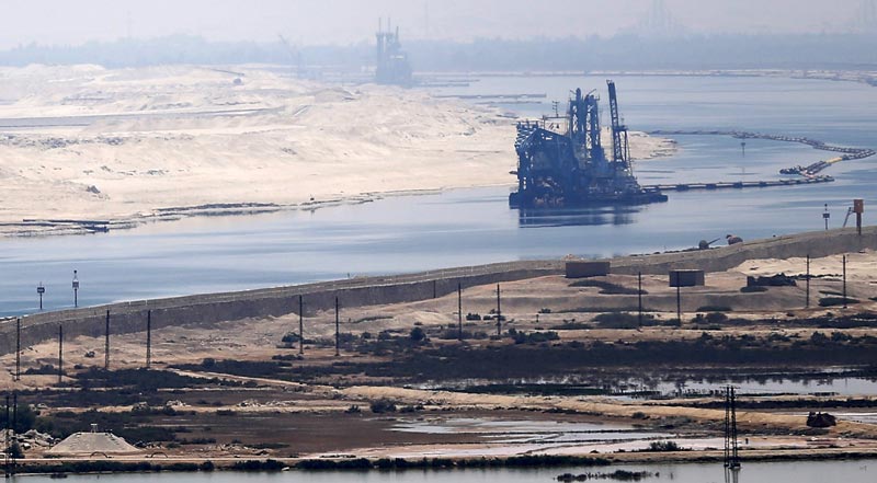 A general view of the Suez Canal from Al Salam "Peace" bridge on the Ismalia desert road before the opening ceremony of the New Suez Canal, in Egypt, August 6, 2015. Egypt will open an expansion to the Suez Canal to great fanfare on Thursday, the centrepiece of President Abdel Fattah al-Sisi's plans to revitalise the country's economy after years of damaging political turmoil. REUTERS/Amr Abdallah Dalsh