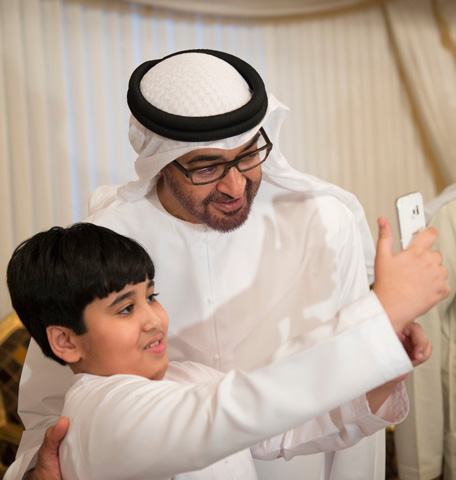 Sheikh Mohamed bin Zayed Al Nahyan Crown Prince of Abu Dhabi Deputy Supreme Commander of the UAE Armed Forces (R), stands for a photograph during condolences for martyr Mohamed Mamdi who passed away while serving in Operation Restoring Hope in Yemen. ( Saeed Al Neyadi / Crown Prince Court - Abu Dhabi)