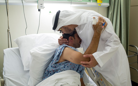 Sheikh Mohamed bin Zayed Al Nahyan, Crown Prince of Abu Dhabi and Deputy Supreme Commander of the UAE Armed Forces, visits a UAE Armed Forces soldier who was injured while serving the UAE Armed Forces in Yemen, seen at Zayed Military Hospital. (Crown Prince Court - Abu Dhabi)