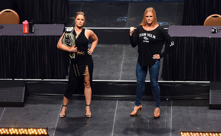 UFC women's bantamweight champion Ronda 'Rowdy' Rousey (left) and challenger Holly Holm pose for the media during the UFC's Go Big launch event inside MGM Grand Garden Arena on September 4, 2015 in Las Vegas, Nevada. (Zuffa LLC via Getty Images)