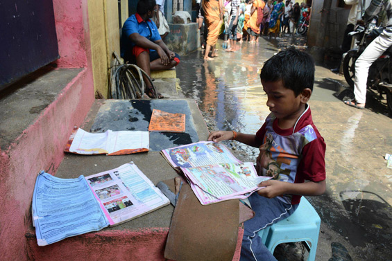 An Indian boy puts his school books out to dry as floodwaters recede in Chennai. Residents in India's southern Tamil Nadu state were grappling with the aftermath of devastating floods as authorities stepped up relief work following the worst deluge in decades that killed over 250 people. (AFP)