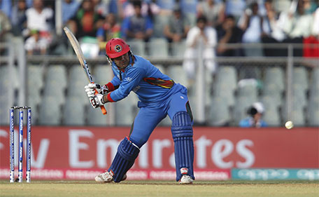 Afghanistan's Mohammad Nabi plays a shot. (Reuters)