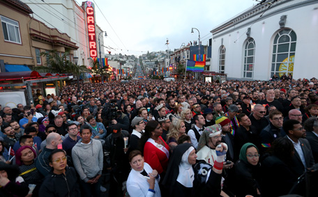 A large crowd listens to speakers during a vigil at Harvey Milk Plaza in the Castro district of San Francisco, Calif., on Sunday, June 12, 2016. The vigil was held for victims of the Orlando, Fla. nightclub shooting which killed at least 50 people and was the deadliest U.S. mass shooting to date. (Oakland Tribune via AP)